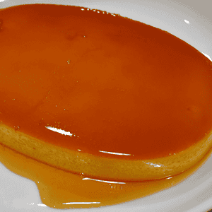 Leche flan, also known as crème caramel or caramel custard, is a popular Filipino dessert that has its roots in Spanish cuisine. It is a rich and creamy dessert made with eggs, condensed milk, evaporated milk, sugar and vanilla extract.