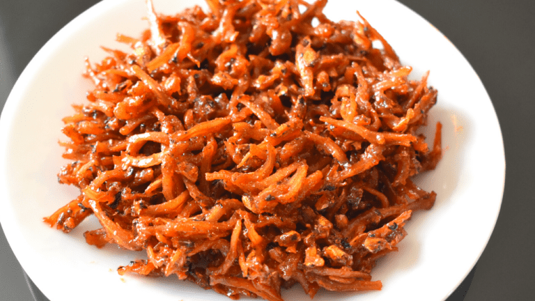 Sweet and spicy dilis is a Filipino fried snack. It consists of small anchovies deep fried with banana ketchup, sugar, and cayenne pepper powder.