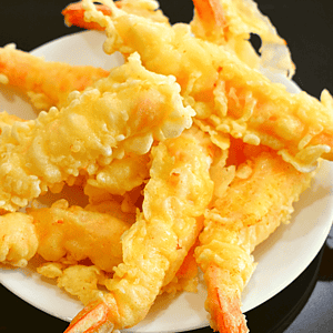 Shrimp tempura is a popular Japanese dish that consists of battered and deep-fried shrimp. The shrimp is typically coated in a light batter made from flour, egg, and water before being fried to a golden crisp.