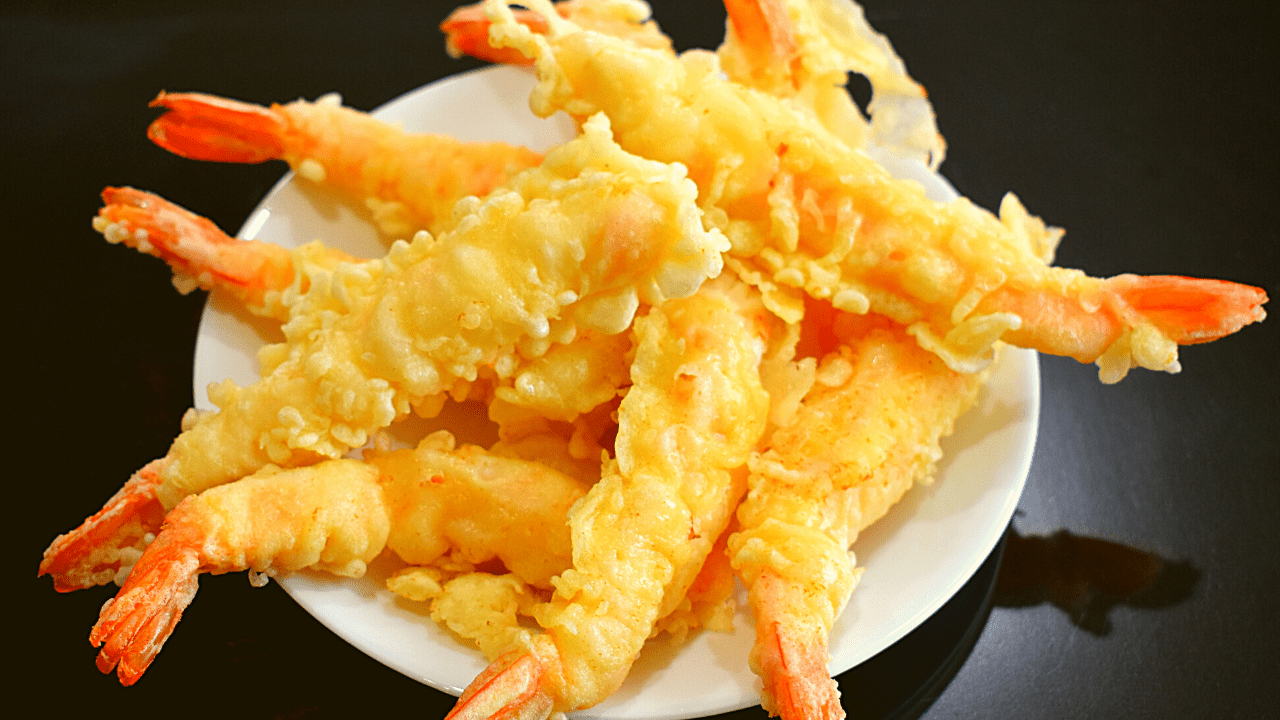 Shrimp tempura is a popular Japanese dish that consists of battered and deep-fried shrimp. The shrimp is typically coated in a light batter made from flour, egg, and water before being fried to a golden crisp.