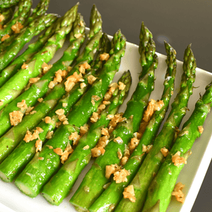 Sautéed garlic asparagus is a dish made by cooking asparagus spears in a pan with olive oil, minced garlic, salt, and pepper. The asparagus is sautéed until tender but still slightly crisp, and the garlic adds a flavorful aroma to the dish.