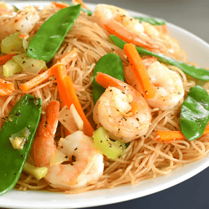 Pancit Bihon Guisado is a popular Filipino noodle dish made with thin rice noodles (bihon), sautéed with vegetables, meat and/or seafood, and flavored with soy sauce, citrus juice, and other seasonings. It is commonly served as a main dish or as a side dish in celebrations and special occasions in the Philippines.