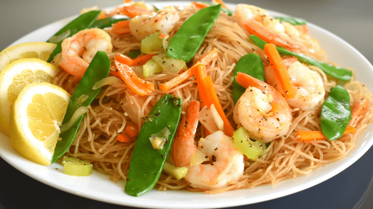 Pancit Bihon Guisado is a popular Filipino noodle dish made with thin rice noodles (bihon), sautéed with vegetables, meat and/or seafood, and flavored with soy sauce, citrus juice, and other seasonings. It is commonly served as a main dish or as a side dish in celebrations and special occasions in the Philippines.