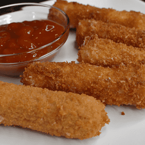 Mozzarella sticks are cheese coated in flour, eggs, and seasoned breadcrumbs, then deep fried until golden brown and crispy. It is one of America's favorite cheesy snacks!