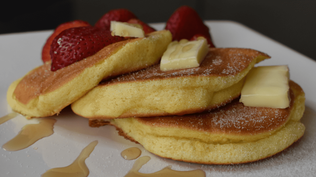 Fluffy Pancakes are a breakfast favorite that has been around for centuries! Traditionally, pancakes were made from a batter of eggs, milk, and flour. The addition of baking powder and other ingredients makes them light and fluffy.