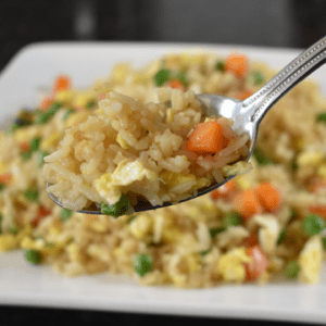 Fried Rice is a dish made with cooked rice and ingredients such as eggs, vegetables, meat, seafood, and sauces.