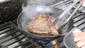 Pan Seared Butter-Basted Steak is a cooking method used to cook steak in a skillet on the stovetop. The steak is first seared in a hot pan to create a flavorful crust, then basted with butter and other seasonings while cooking.
