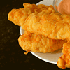 Fried chicken tenders, also known as chicken fingers or chicken strips, are a classic fast food dish that originated in the United States.