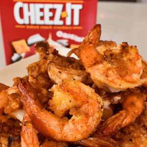 An appetizer or main course created by combining two flavors of Cheez It crackers and shrimp.