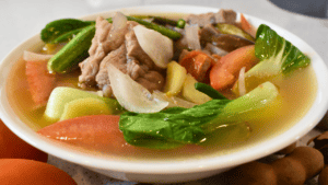 Classic Pork Sinigang is a traditional Filipino dish. It is a sour and savory soup made with slow-cooked pork meat, an array of vegetables, and tamarind, which gives the dish its distinct tangy flavor.