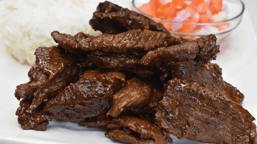 Beef tapa is a traditional Filipino dish made with thinly sliced beef that has been marinated in a mixture of soy sauce, calamansi juice (or lemon juice), sugar, and various spices.