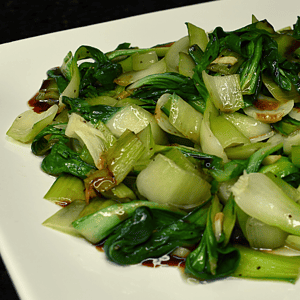 Bok choy stir fry is a popular Chinese dish made with bok choy (a type of Chinese cabbage), stir fried with various vegetables and sometimes meat or tofu. It is typically cooked in a wok or frying pan with oil, garlic, ginger, and soy sauce for flavor.