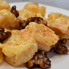 Walnut shrimp is a popular Chinese dish that consists of large, juicy shrimp coated in a sweet and creamy sauce, topped with crunchy walnuts.