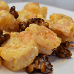 Walnut shrimp is a popular Chinese dish that consists of large, juicy shrimp coated in a sweet and creamy sauce, topped with crunchy walnuts.