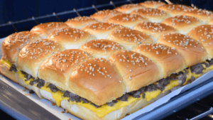 Cheeseburger sliders are a delicious and convenient twist on the classic American burger. These mouth-watering mini burgers consist of a juicy beef patty, melted cheese, and various toppings sandwiched between two soft slider buns.