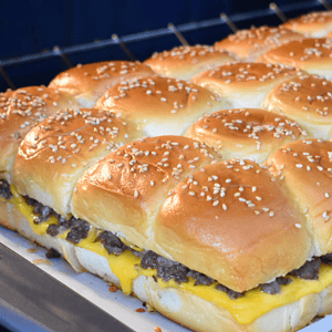 Cheeseburger sliders are a delicious and convenient twist on the classic American burger. These mouth-watering mini burgers consist of a juicy beef patty, melted cheese, and various toppings sandwiched between two soft slider buns.