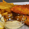 Fish and chips is a classic British dish that has been enjoyed for centuries. It consists of battered and deep-fried fish, usually cod or haddock, served with crispy fries (chips).