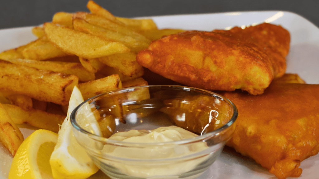 Fish and chips is a classic British dish that has been enjoyed for centuries. It consists of battered and deep-fried fish, usually cod or haddock, served with crispy fries (chips).