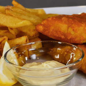 Fish and chips is a classic British dish that has been enjoyed for centuries. It consists of battered and deep-fried fish, usually cod or haddock, served with crispy fries (chips).