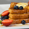 French toast, also known as "eggy bread" or "pain perdu" in French, is a popular breakfast dish that originated from Western Europe. It is made by soaking slices of bread in a mixture of beaten eggs and milk, then frying them until they are golden brown on both sides.