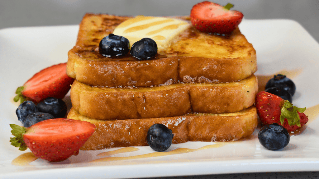 French toast, also known as "eggy bread" or "pain perdu" in French, is a popular breakfast dish that originated from Western Europe. It is made by soaking slices of bread in a mixture of beaten eggs and milk, then frying them until they are golden brown on both sides.