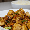 Kung pao tofu is a delicious and popular Chinese dish that originated in the Sichuan province. It is a flavorful and spicy stir-fry made with tofu, peanuts, vegetables, and a variety of sauces.