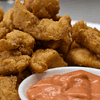 Popcorn chicken is a popular snack that originated in the United States. It consists of bite-sized pieces of chicken, typically coated in batter or breadcrumbs and then deep-fried until crispy.