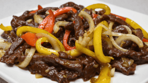 Beef stir fry is a popular dish that combines tender beef, savory onions, and crisp bell peppers into one flavorful meal. This delicious dish has its roots in Asian cuisine, but has become a household favorite all around the world.